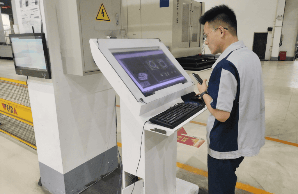 Jonble inspector checking industrial equipment at a factory in China